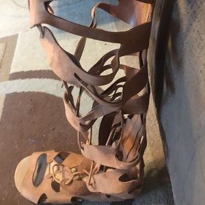 Knee-high gladiator sandals.
